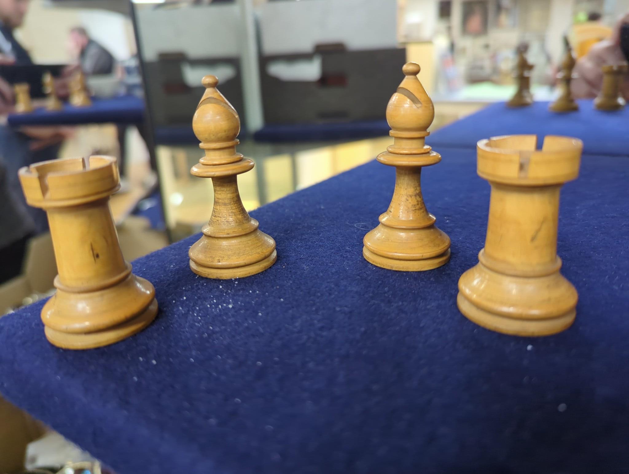 After Mene, a bronze greyhound, a Staunton-pattern chess set and a set of Victorian postal scales, bronze 22cms wide